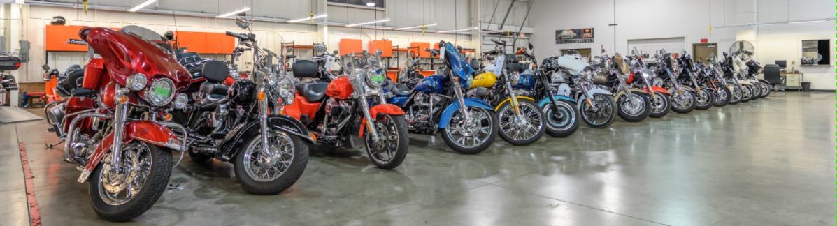 Several Harley-Davidson® motorcycles parked inside the Adventure Harley-Davidson® service department